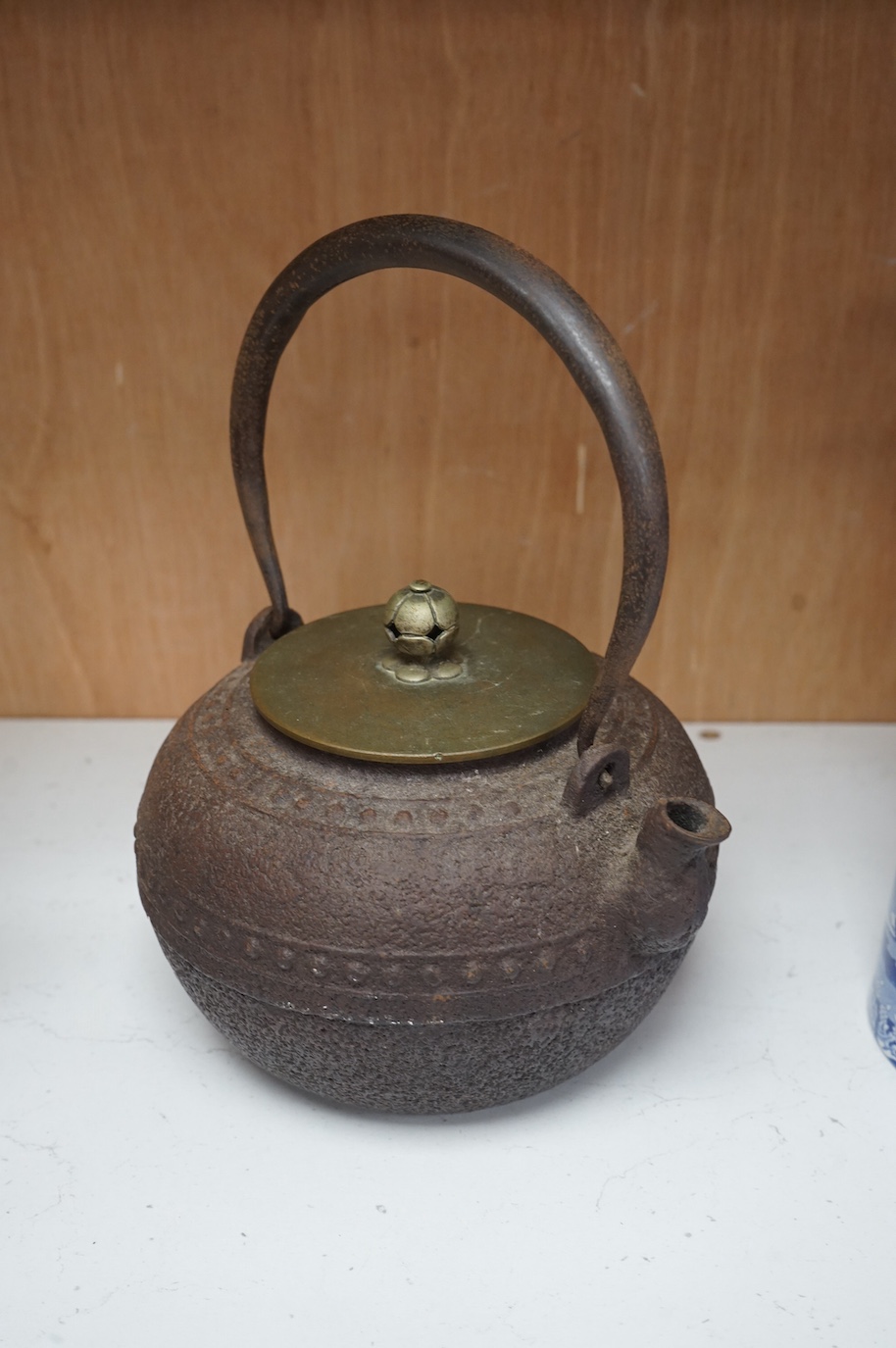 A Japanese cast-iron teapot, 22.5cm high